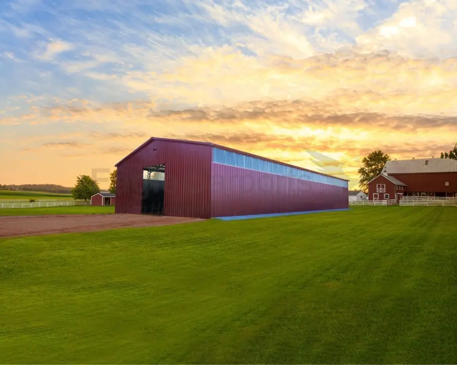 Red metal barn at sunset