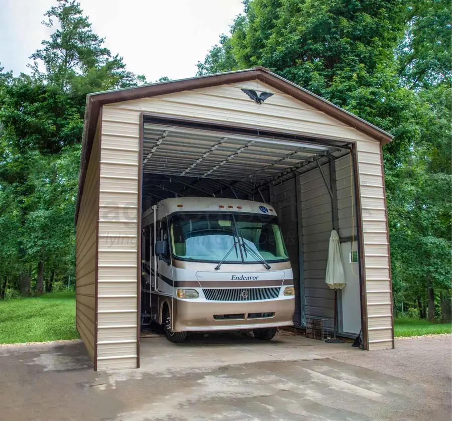Motorhome parked under a tall enclosed metal RV cover